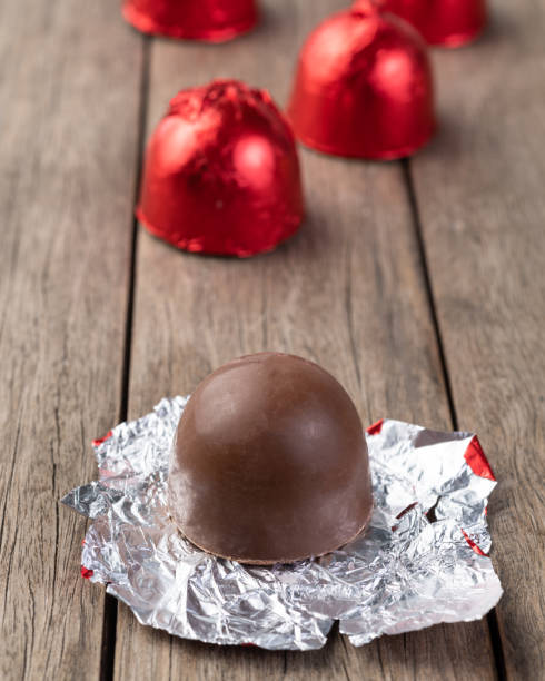 istock Filled chocolate candy with candies packed in red foil paper 1408085371