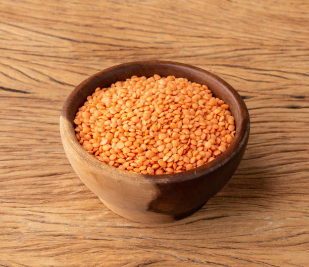 istock Orange lentil in a bowl over wooden table 1408085378