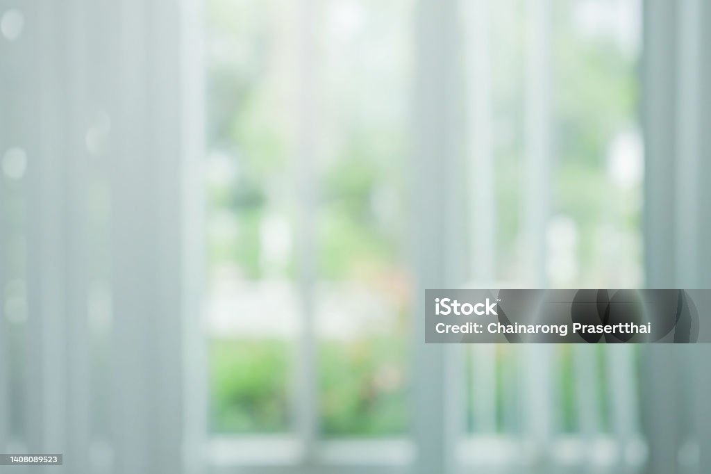 abstract blur modern garden looking through living room window in the home for background concept Backgrounds Stock Photo