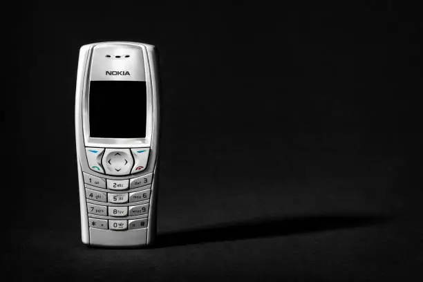 WARSAW, POLAND - JUNE 30 2022: Cell Phone Nokia 6610 on black background.
