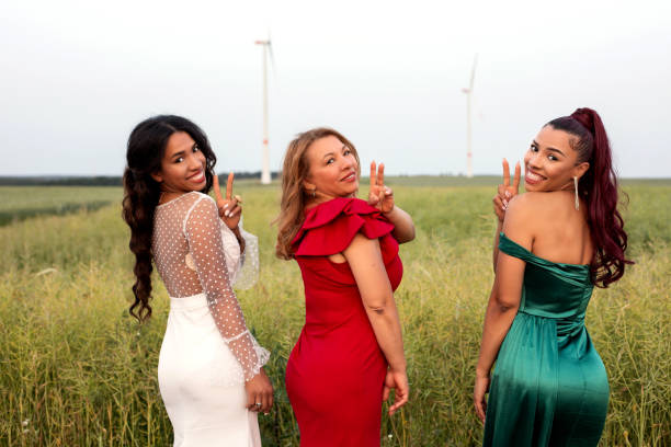 three hispanic women standing outoors in a field portrait of three hispanic women standing outoors in a field mother of the bridal dress stock pictures, royalty-free photos & images