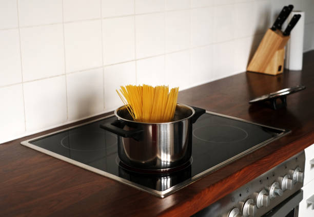 istock spaghetti in a pan on an induction stove close-up 1408091441