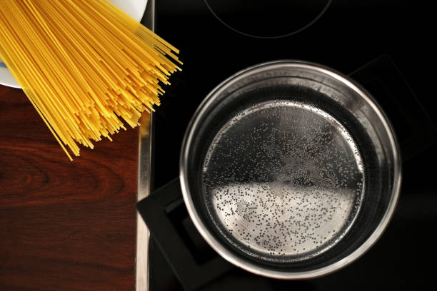 istock spaghetti pot on induction hob. home italian cuisine 1408092161