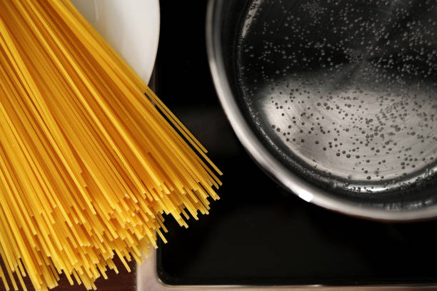 istock spaghetti pot on induction hob. home italian cuisine 1408092233