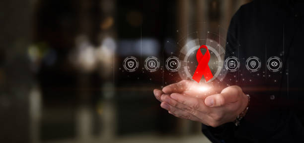 istock Hands show red AIDS awareness ribbon. 1408092783