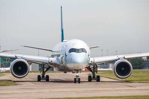 Manchester Airport, United Kingdom - 16 June 2022: Cathay Pacific Airbus A350 (B-LRU) entering runway 23L for take off to Hong Kong.