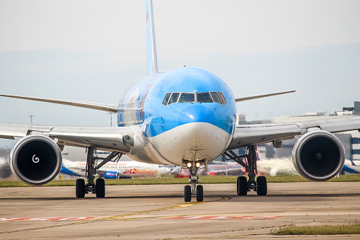 Manchester Airport, United Kingdom - 16 June 2022: TUI Boeing 767 (G-OBYF) taxiing towards runway 23L for take off to Gran Canaria, Spain.