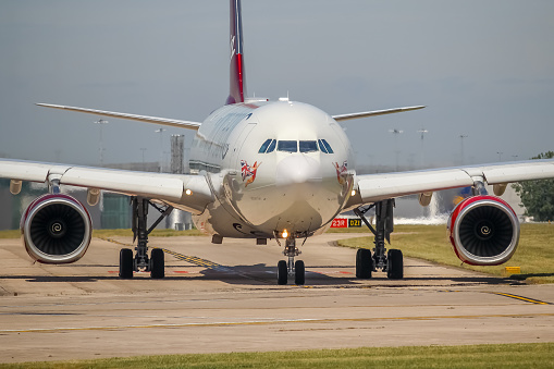 Manchester Airport, United Kingdom - 16 June 2022: Virgin Atlantic Airbus A330 (G-VNYC) taxiing towrads runway 23L for take off to New York (JFK), United States.