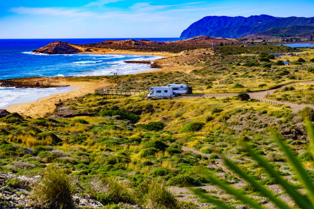 istock Coast view with camper rv camping on sea shore, Spain 1408104993