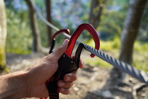 Carabiners on a rope on a via ferrata in Austria.