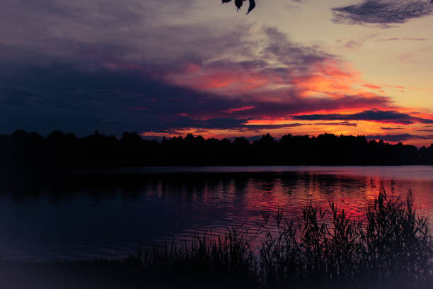 Super moody lake sunset stock photo
