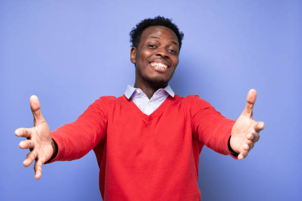 istock Cheerfull african man wanting to cuddle, smiling broadly 1408107339