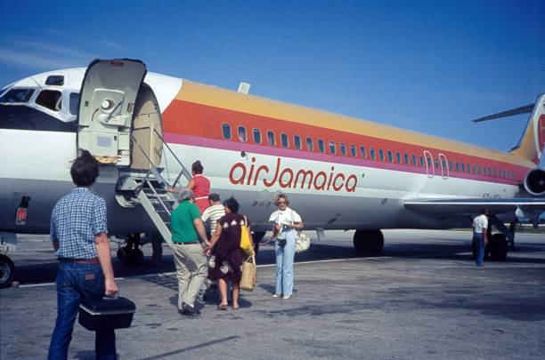 Kingston, Jamaica, 1980. Passengers board a plane at Kingston Airfield.