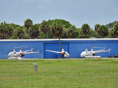 Fort Lauderdale, Broward County, Florida USA, July 4, 2022.  Helicopters parked in front of the airport hangar at the Fort Lauderdale Executive Airport.