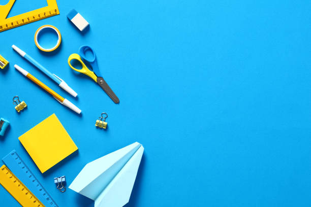 istock Flat lay school stationery on blue table. Back to school concept. Flat lay, top view 1408109423