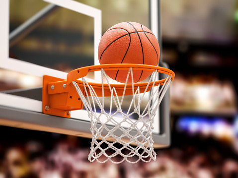 Basketball ball scoring the winning  points on basketball net hoop on basketball arena. 3d illustration