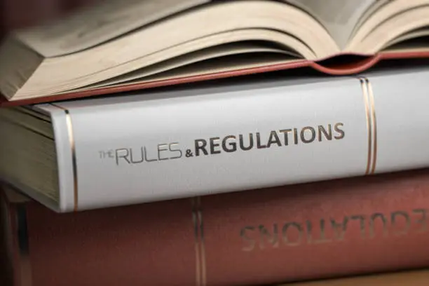 Photo of Rules and regulations book. Law, rules and regulations concept.