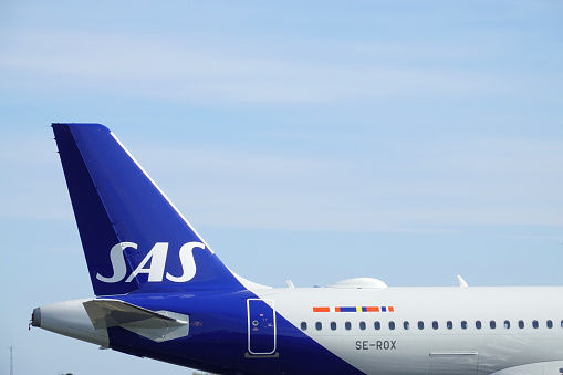 SAS airplanes on the ground in Denmark.\nHundreds of SAS flights got cancelled as the airline pilots went on strike.\nThe Scandinavian airline has been forced to cancel hundreds of flights since talks with pilots over a new collective bargaining agreement collapsed.