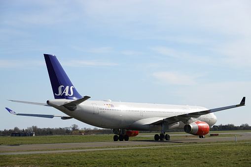 SAS airplanes on the ground in Denmark.\nHundreds of SAS flights got cancelled as the airline pilots went on strike.\nThe Scandinavian airline has been forced to cancel hundreds of flights since talks with pilots over a new collective bargaining agreement collapsed.