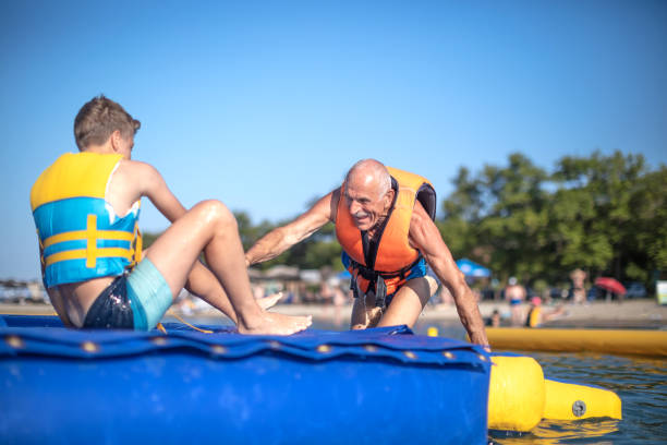istock Old senior having fun in Water Park 1408113610
