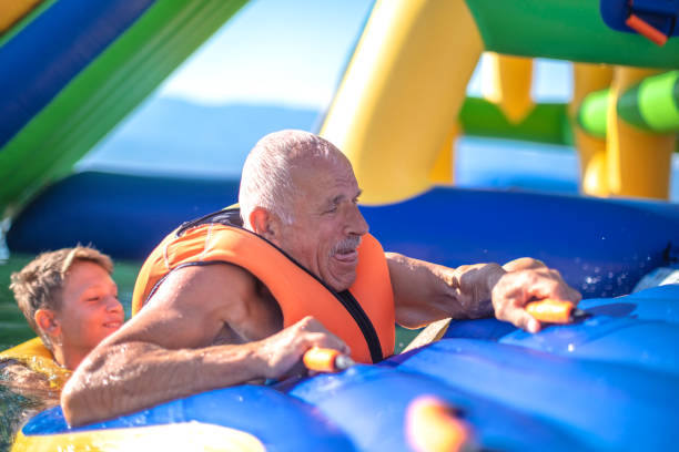 istock Old senior having fun in Water Park 1408113698