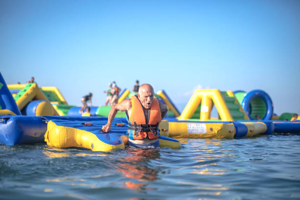 istock Old senior having fun in Water Park 1408114088