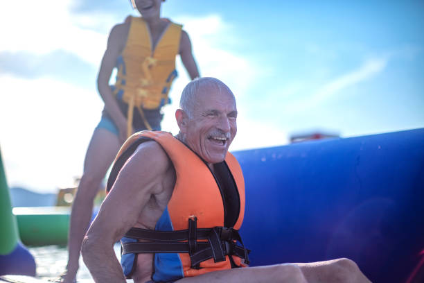 istock Old senior having fun in Water Park 1408114877