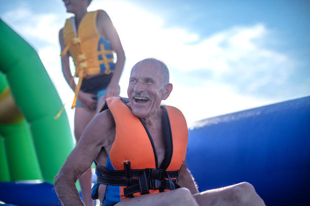 istock Old senior having fun in Water Park 1408114882
