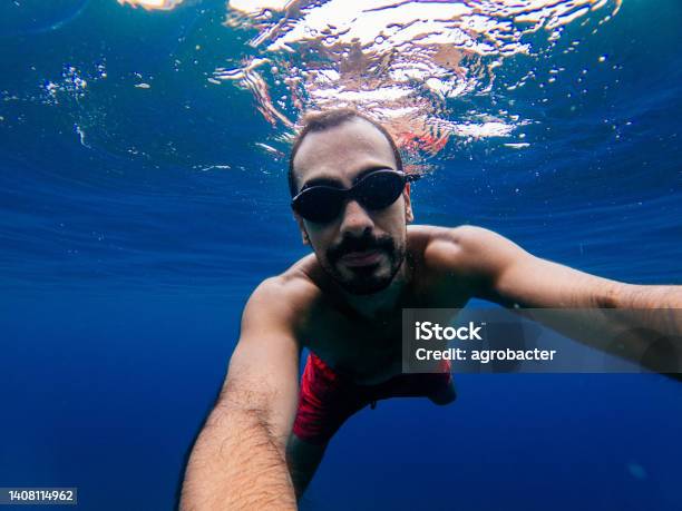 Man Enjoying At Sea Stock Photo - Download Image Now - Underwater, Holding Breath, One Person