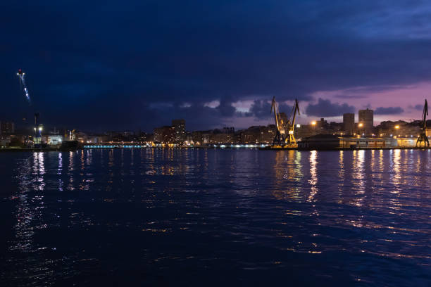 istock Cargo cranes in the seaport at night 1408116069