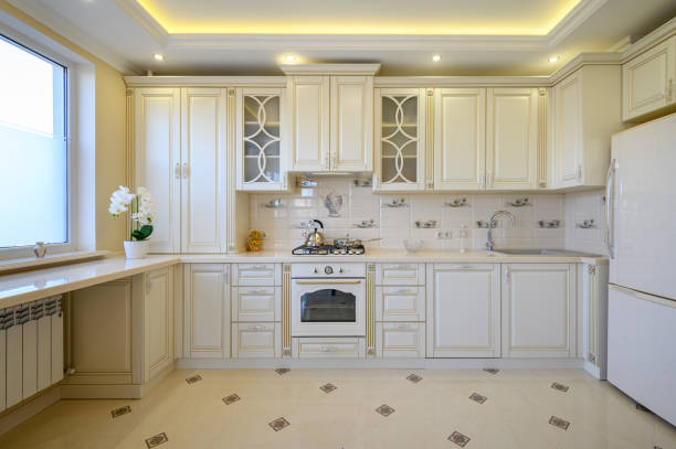 istock Classic white and beige large luxurious kitchen in studio apartment 1408116588