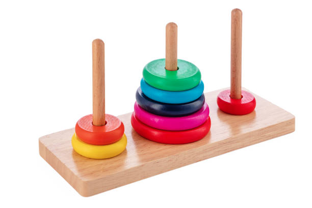 Wooden puzzle tower of hanoi with color rings isolated on white background. Toy for kids. stock photo