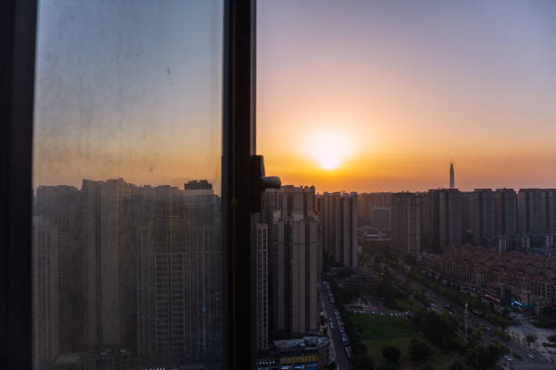 istock The bustling city outside the sunset window 1408119809