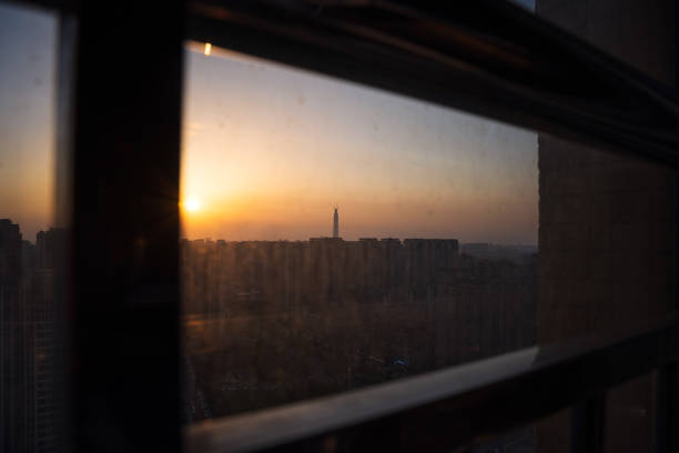 The bustling city outside the sunset window
