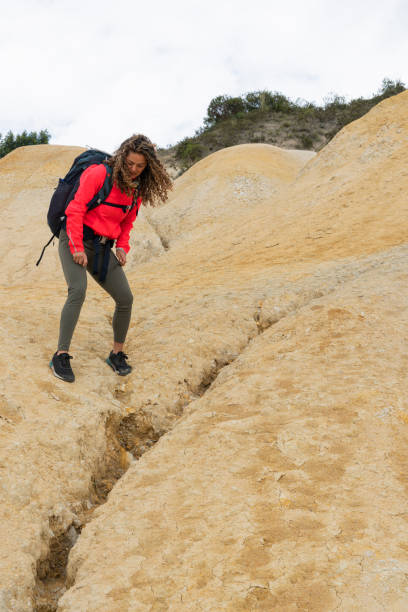 istock latin woman walks through desert surrounded by nature 1408119853