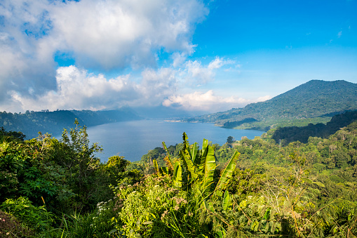 The beautiful lake Danau Buyan in a crater in the tropical rainforest of Bali