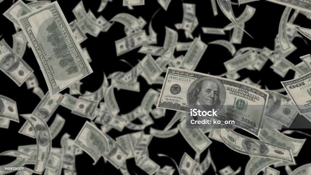 Falling Dollar bills banknotes falling rain isolated transparent on black screen background. Currency Stock Photo