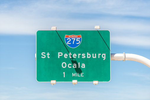 Tampa, Florida area with road street interstate highway green sign for i275 south to St Petersburg and Ocala text isolated closeup and sky