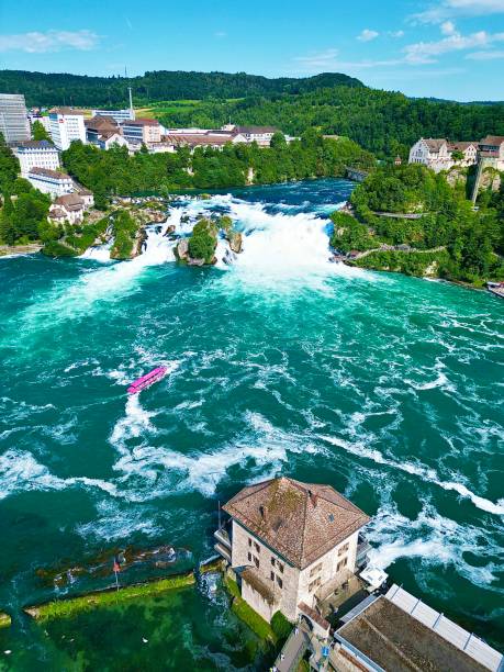 The Rhine Falls, an amazing spectacle. Huge volumes of water fall over the rocks across a width of 150m.