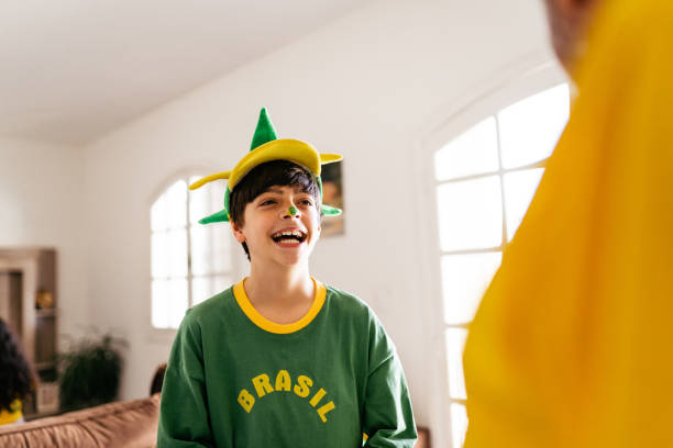 istock Smiling Brazil fan boy at home 1408130809
