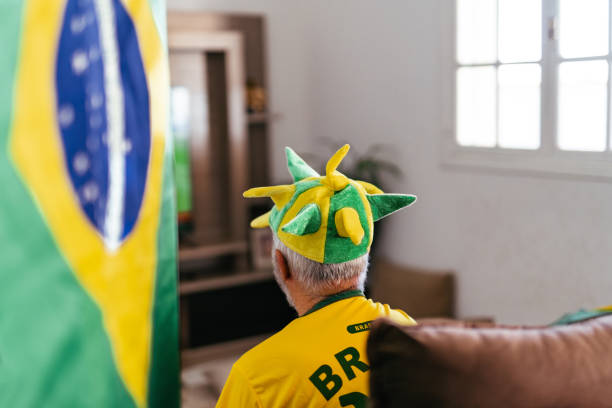 istock Elderly Brazil fan watching game 1408130826