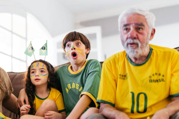 Brazilian boy watching an amazing move Brazilian boy watching an amazing move international match stock pictures, royalty-free photos & images