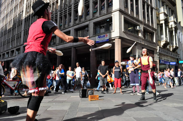 Porto Alegre, Rio Grande do Sul, Brazil - Nov 17th, 2010: People watching a street performance at Democratic Corner