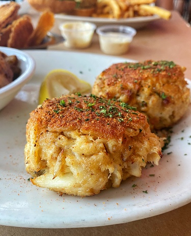 Two plump crab cakes with crabmeat and spices