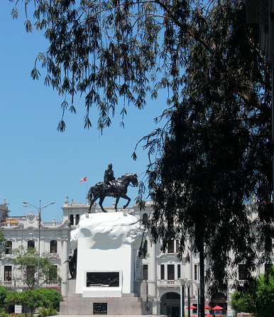 Madrid, Spain - October 29, 2022: Puerta del Sol buildings and statue on a sunny day.