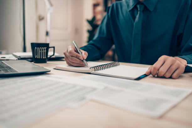 istock Investors working on desk office and using a pan and pointing to check tracking cost, balance, profit and  currency. Accounting and  Financial concept. 1408150497