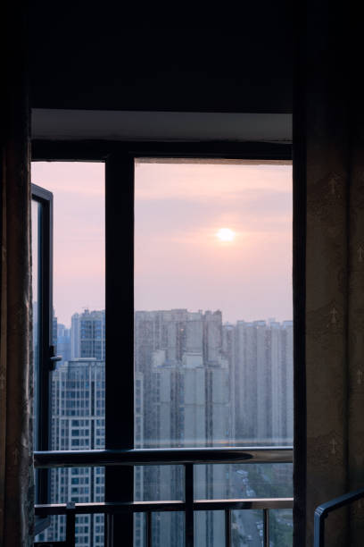 istock The bustling city outside the sunset window 1408150610