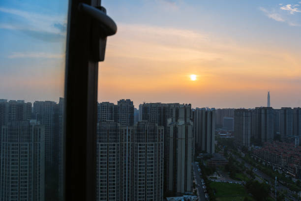 istock The bustling city outside the sunset window 1408150621
