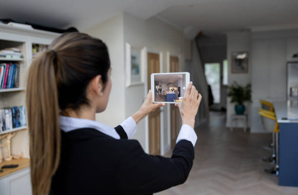 istock Real estate agent making a virtual tour of a house using a tablet 1408150644