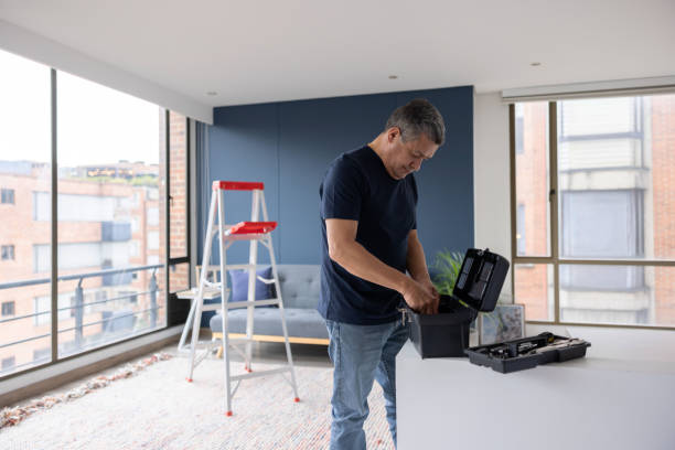 istock Electrician working at an apartment and using his toolbox 1408152959